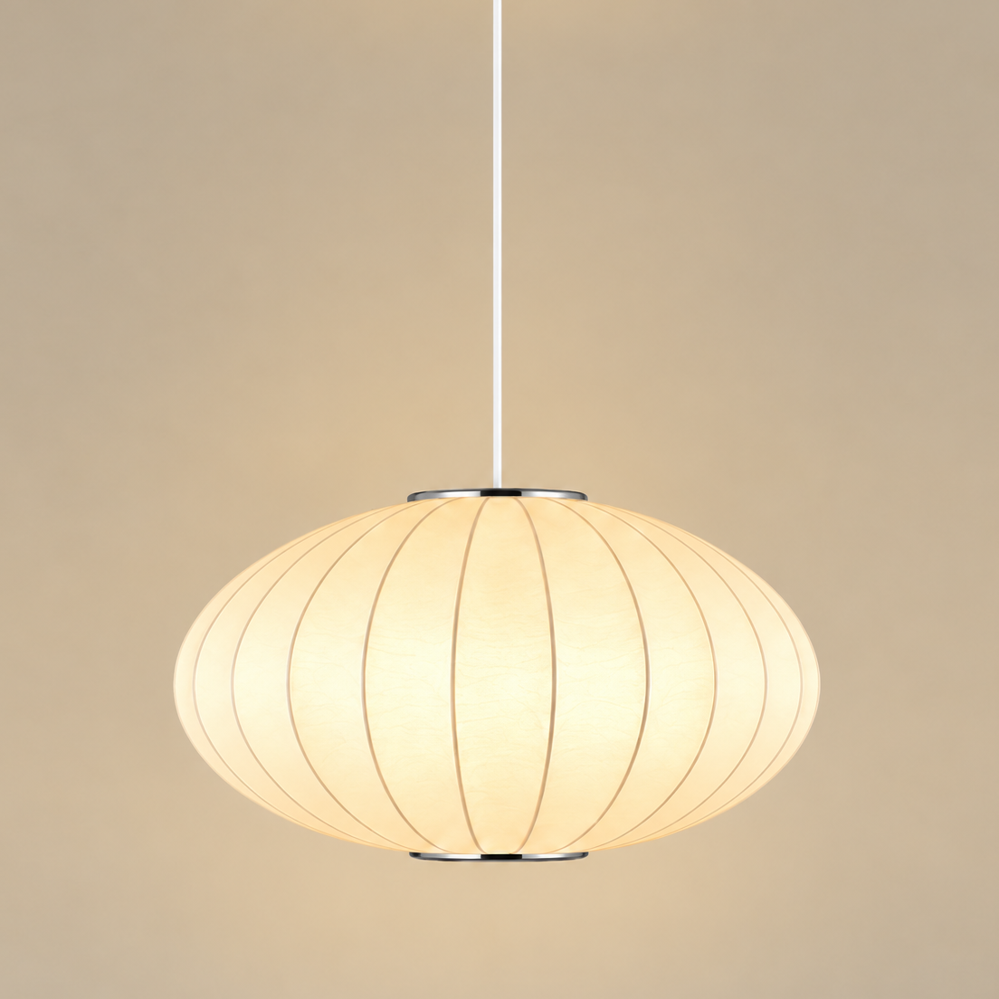 A modern pendant light with a warm white ribbed dome shade, suspended by a slim white cord from a white ceiling canopy against a solid beige background.