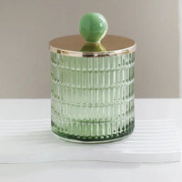 Textured glass canister with colorful knob and metal lid storage jar