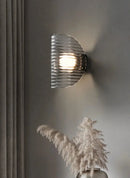 Modern ribbed glass wall lamp black finish ambient lighting half moon sconce contemporary interior