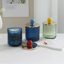 Textured glass canister with colorful knob and metal lid storage jar