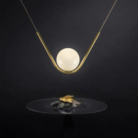 Harmony Glass & Brass pendant with plated brass curved bar and 15cm frosted globe 50cm width